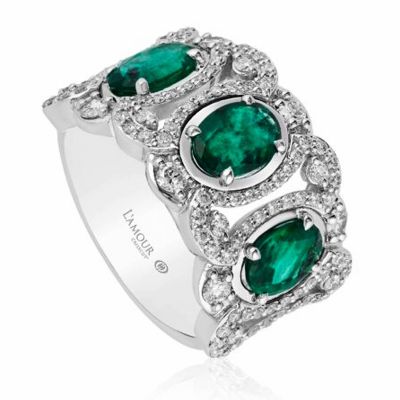 Oval cut three-stone emerald and diamond ring